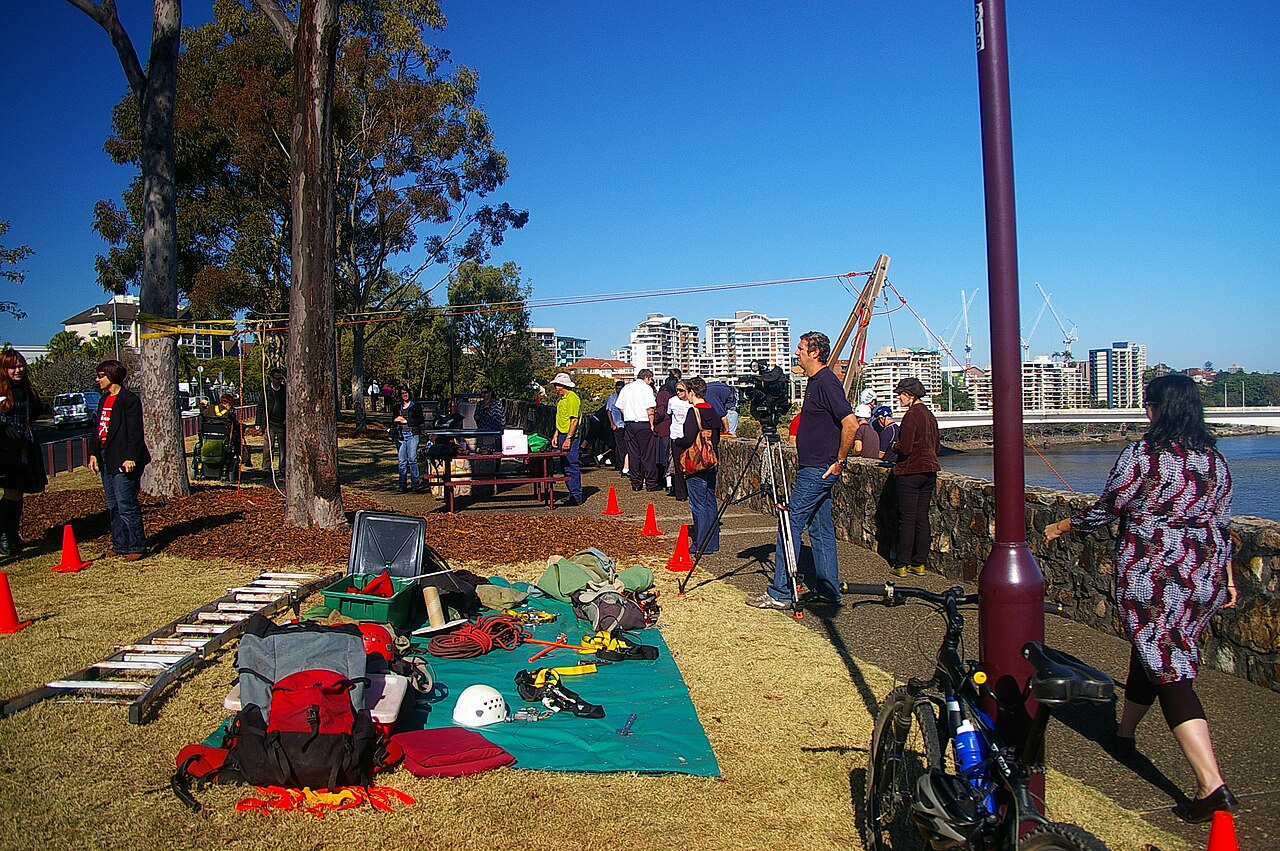 John Robert McPherson · CC BY-SA 4.0 · https://creativecommons.org/licenses/by-sa/4.0 · https://commons.wikimedia.org/wiki/File:NDIS_Promotion_abseiling_Kangaroo_Point_cliffs_River_Tce_Kangaroo_Point_Brisbane_IMGP6001.jpg Ropes and equipment laid out for an organised outdoor abseiling event