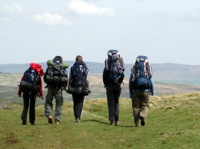 Leedsdoggod · CC BY 3.0 · https://creativecommons.org/licenses/by/3.0 · https://commons.wikimedia.org/wiki/File:DofE-group.jpg A youth expedition group walking with rucksacks on open hill ground
