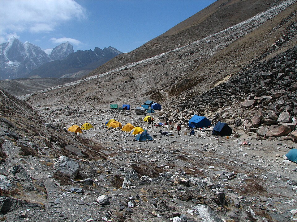 McKay Savage from London, UK · CC BY 2.0 · https://creativecommons.org/licenses/by/2.0 · https://commons.wikimedia.org/wiki/File:Nepal_-_Island_Peak_-_001_-_Base_camp_(497785952).jpg · Displayed cropped to fit Tents at Island Peak Base Camp
