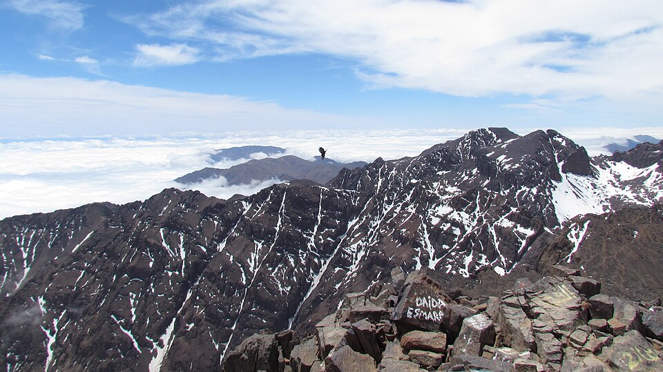 A broad view from Toubkal’s rocky summit towards Ouanoukrim