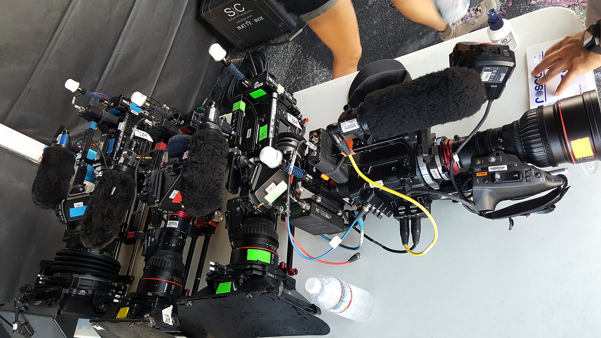 Professional cinema cameras and support equipment prepared at a production camera station