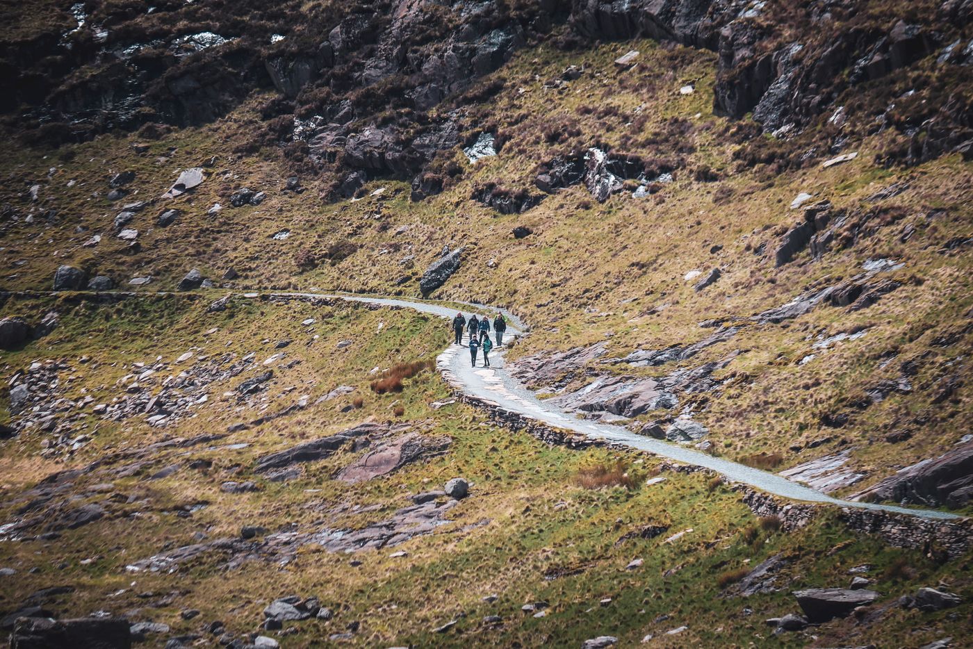Boys in Bristol Photography · Pexels License · https://www.pexels.com/license/ · https://www.pexels.com/photo/19952925/ Walkers following a mountain path in Wales