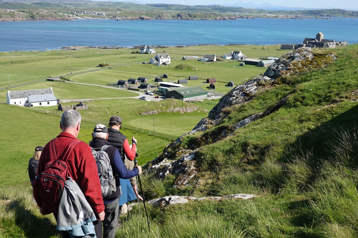 John Bailer · Pexels License · https://www.pexels.com/license/ · https://www.pexels.com/photo/35583737/ A walking group exploring the Scottish island of Iona