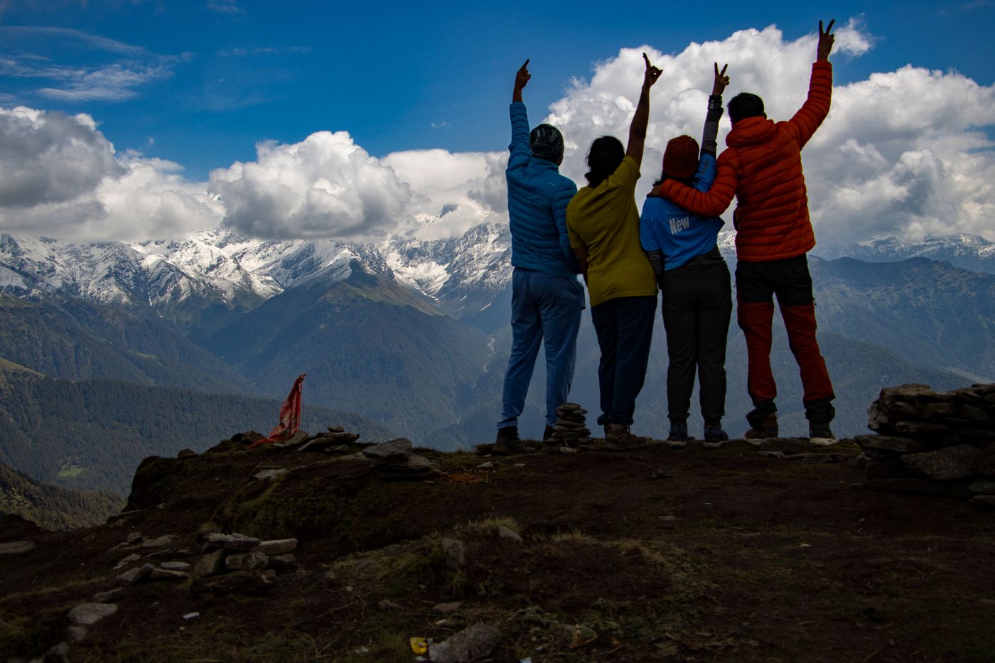 Arijit Dey · Pexels License · https://www.pexels.com/license/ · https://www.pexels.com/photo/39972297/ Three walkers celebrating reaching a Himalayan viewpoint