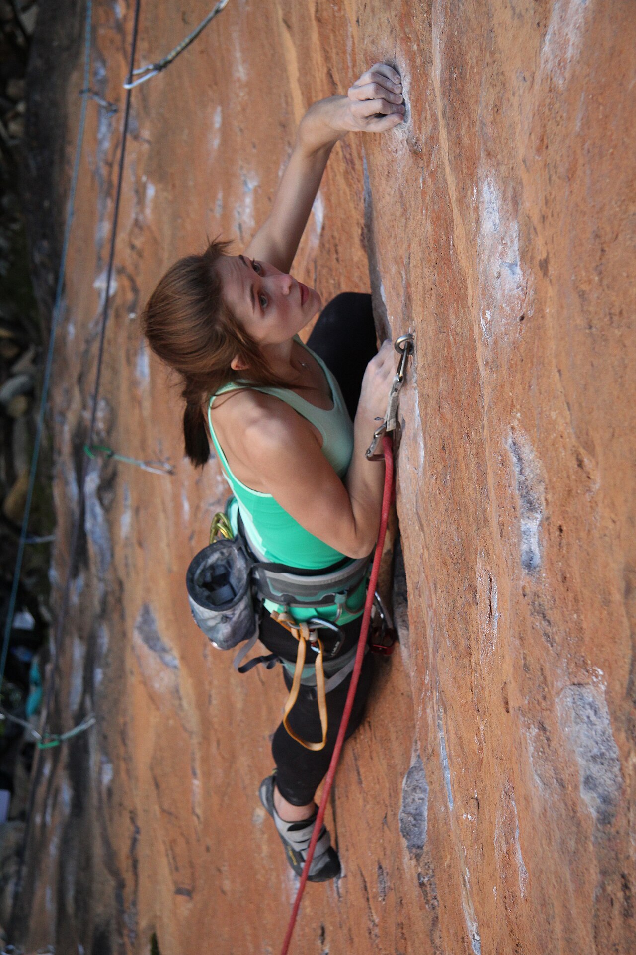 Adam Kubalica · CC BY 2.0 · https://creativecommons.org/licenses/by/2.0 · https://commons.wikimedia.org/wiki/File:Sport_Climb_Shipley_Upper_2.jpg · Displayed cropped to fit A sport climber ascending a bolted outdoor rock route