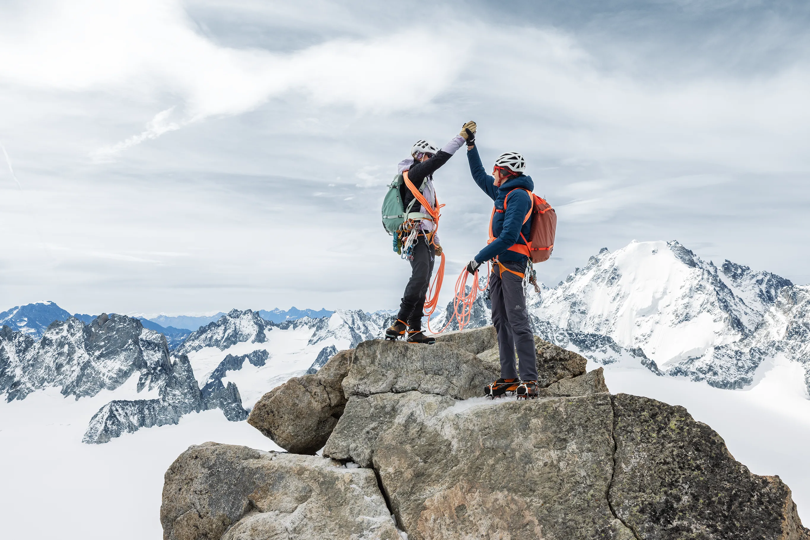 Activity reference photograph supplied for the SOOM website Two equipped mountaineers together on an Alpine summit