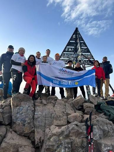 Activity reference photograph supplied for the SOOM website A healthcare charity team celebrating at the Toubkal summit