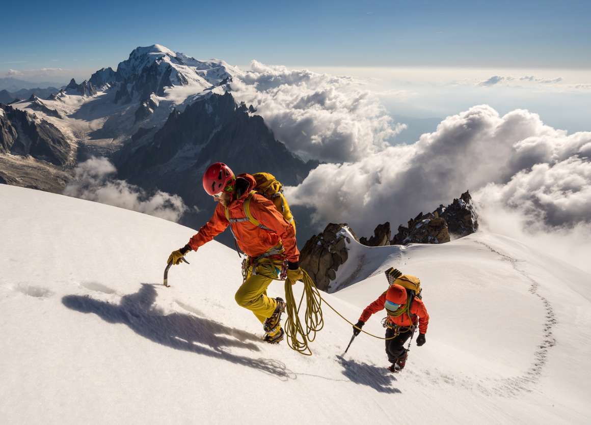 Activity reference photograph supplied for the SOOM website A roped pair ascending snow-covered Alpine terrain